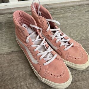 Pink high top vans, white laces. Only worn a few times. Has a suede material.